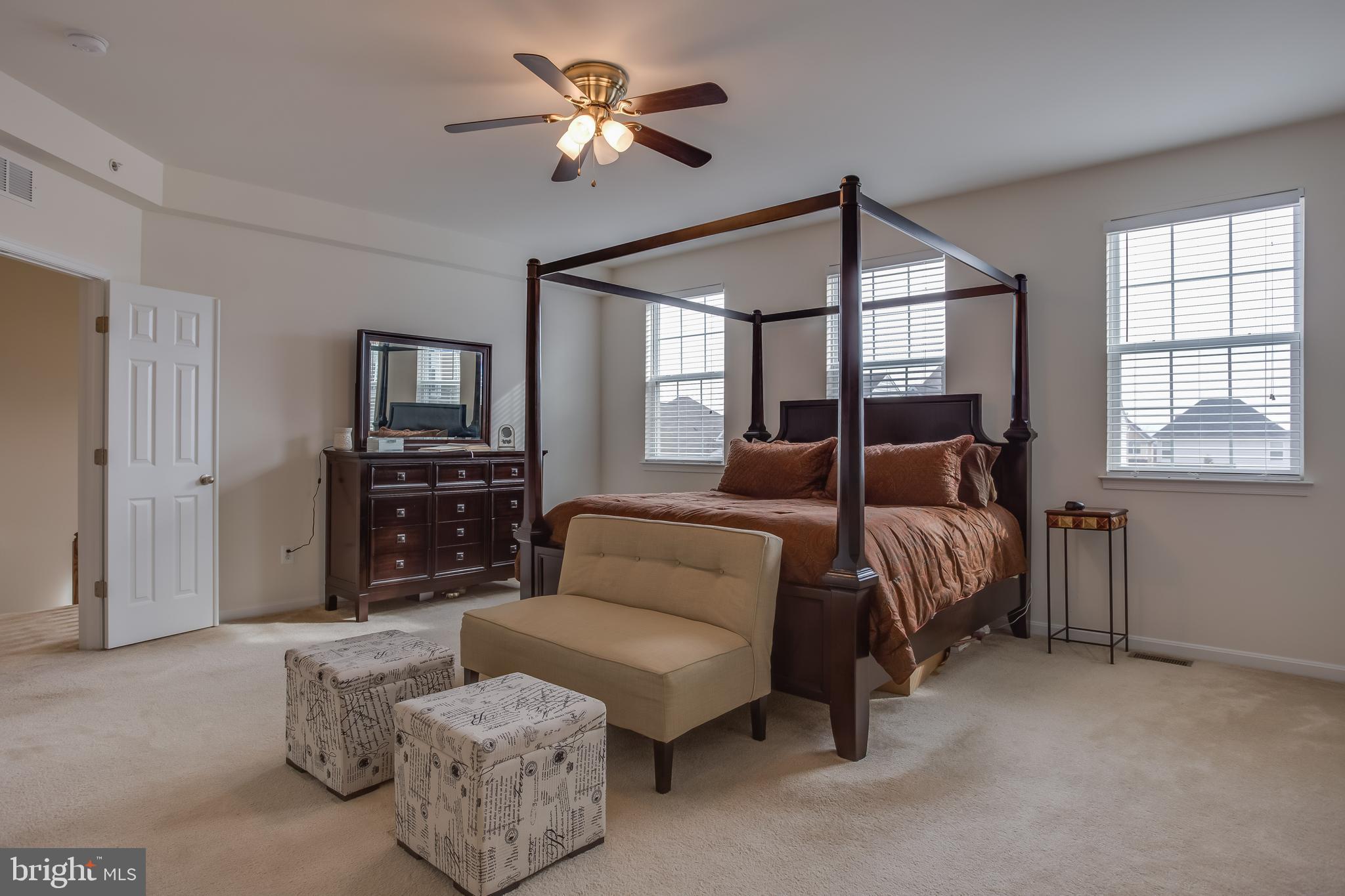 3437 Eagle Ridge Drive Woodbridge, VA 22191 - Photo 16 of 40 a bedroom with a bed chandelier and window