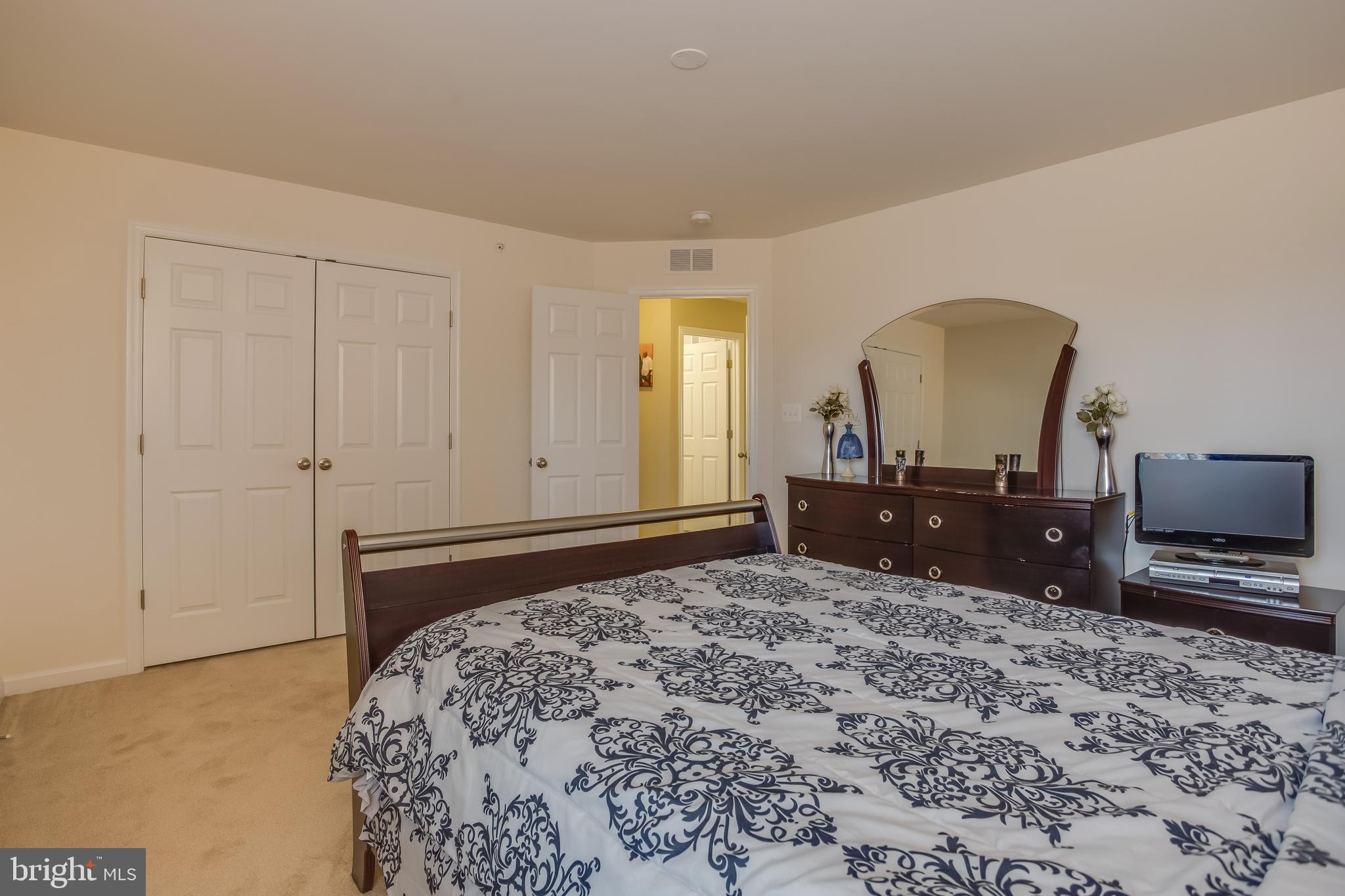 3437 Eagle Ridge Drive Woodbridge, VA 22191 - Photo 23 of 40 a bedroom with a bed and a flat screen tv