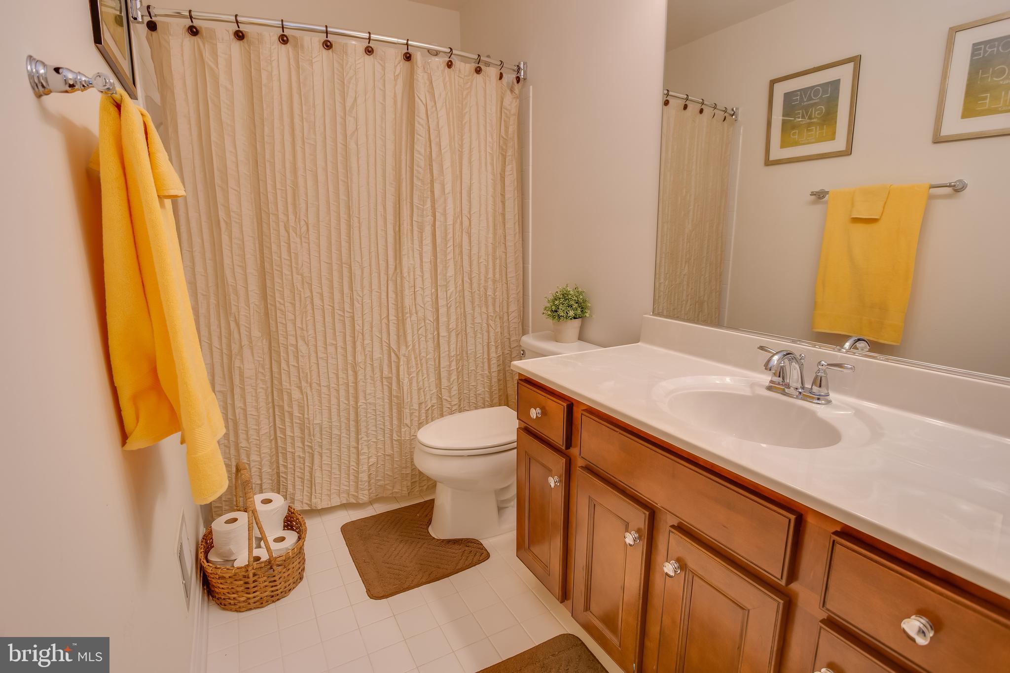 3437 Eagle Ridge Drive Woodbridge, VA 22191 - Photo 24 of 40 a bathroom with a granite countertop sink and a mirror