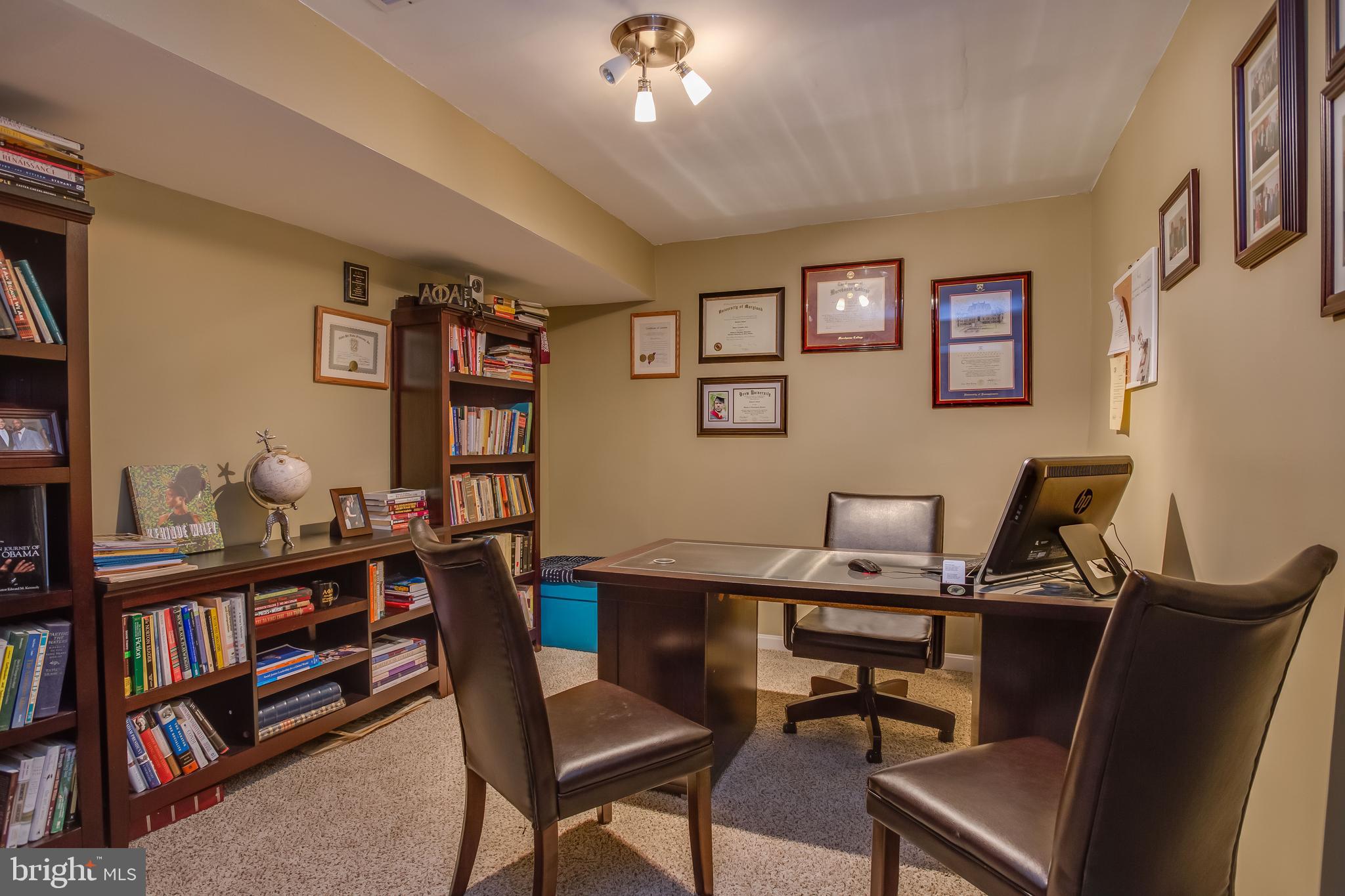3437 Eagle Ridge Drive Woodbridge, VA 22191 - Photo 34 of 40 a view of a workspace with a bookshelf