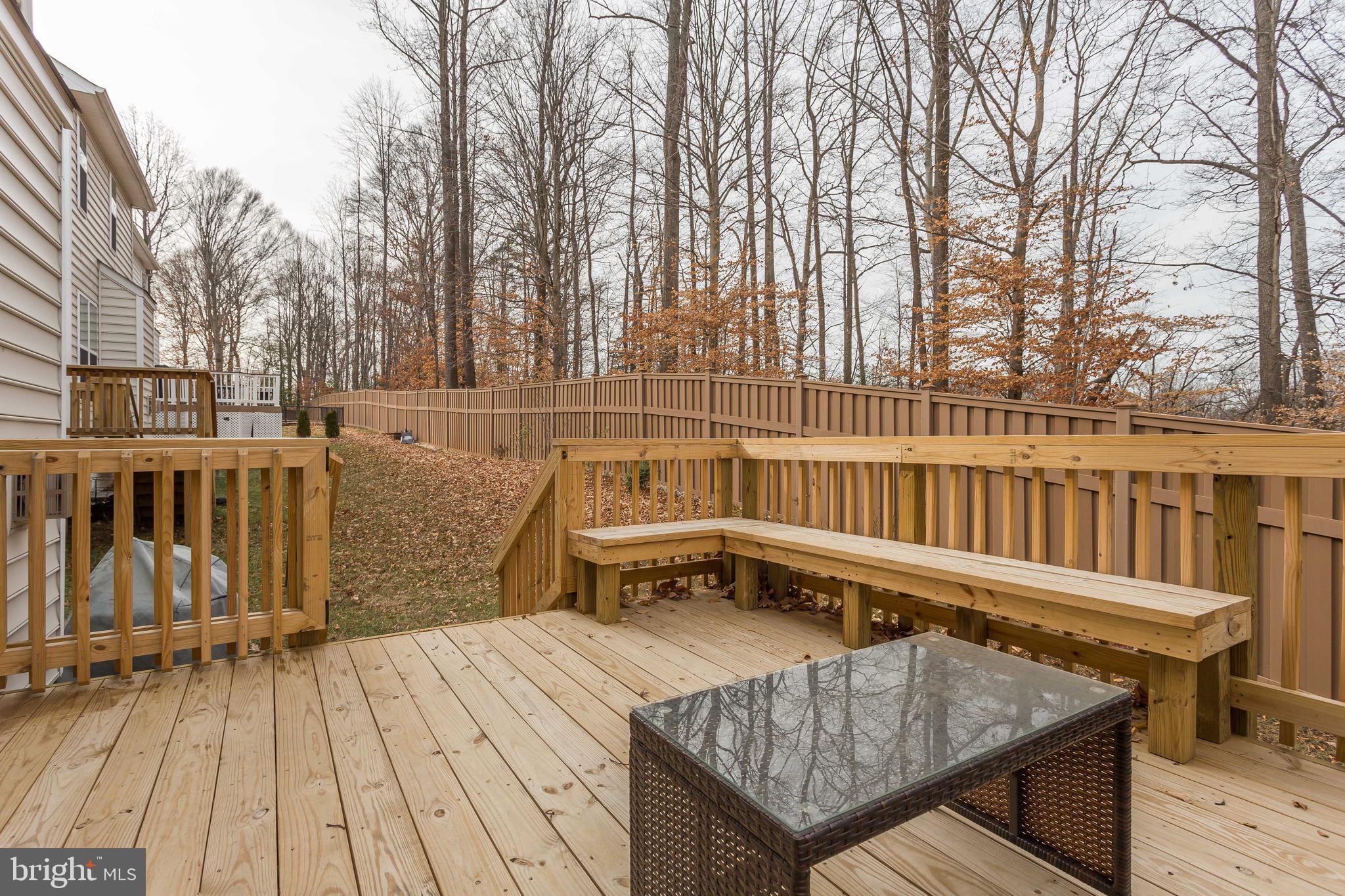 3437 Eagle Ridge Drive Woodbridge, VA 22191 - Photo 35 of 40 swimming pool view with wooden fencing