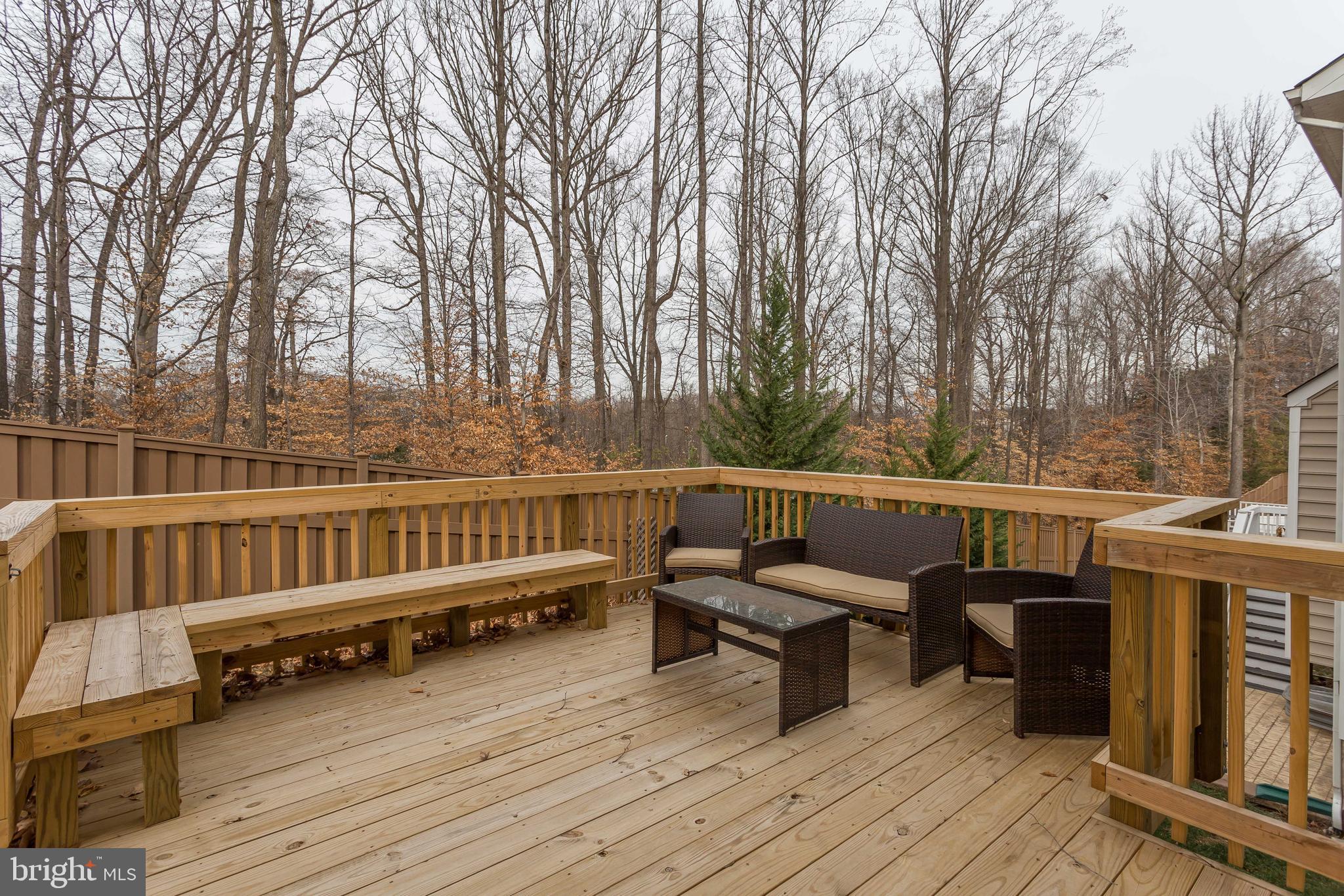 3437 Eagle Ridge Drive Woodbridge, VA 22191 - Photo 37 of 40 a view of a balcony with chairs and wooden fence