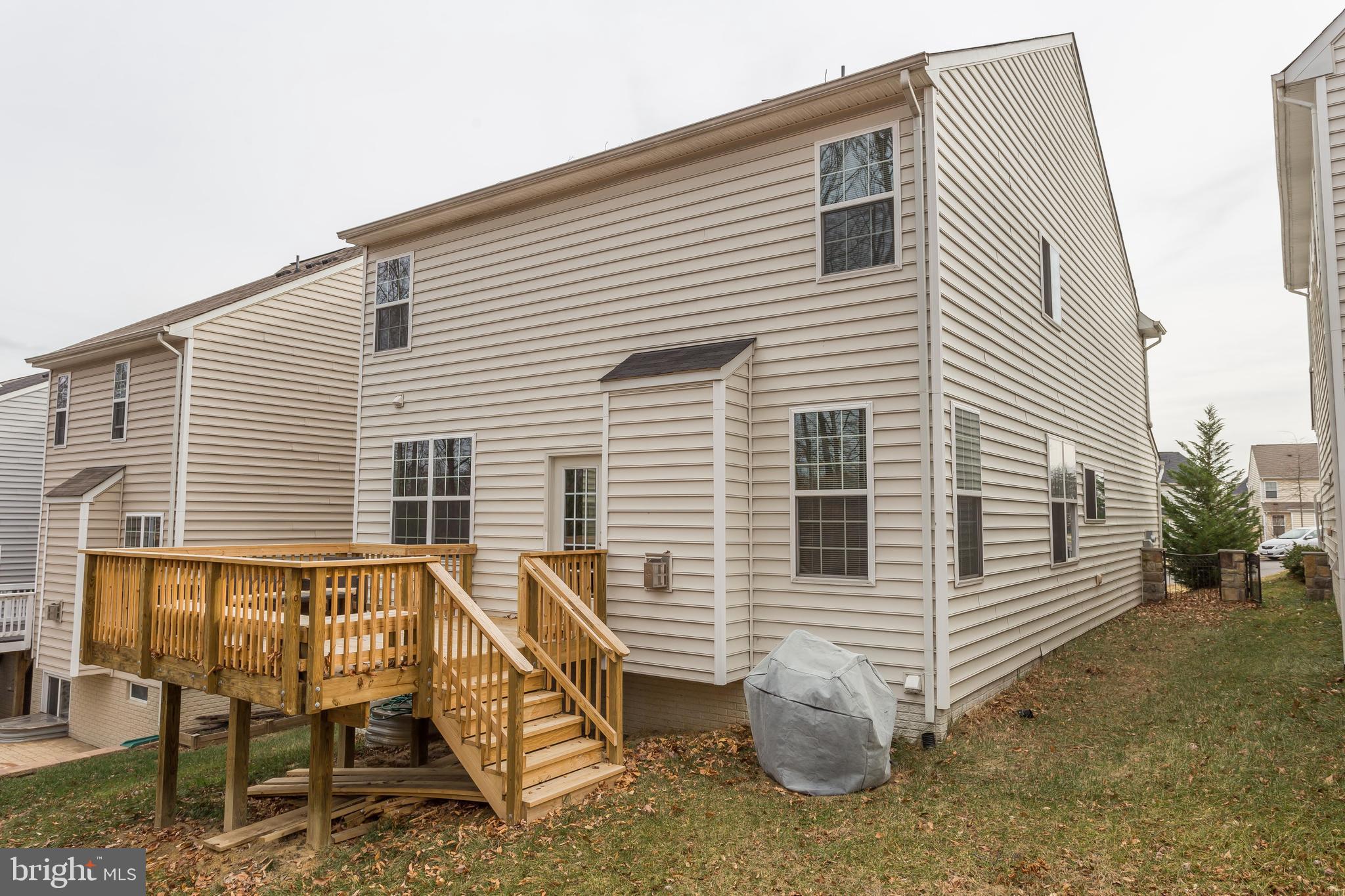 3437 Eagle Ridge Drive Woodbridge, VA 22191 - Photo 39 of 40 a view of a house with a yard and sitting area