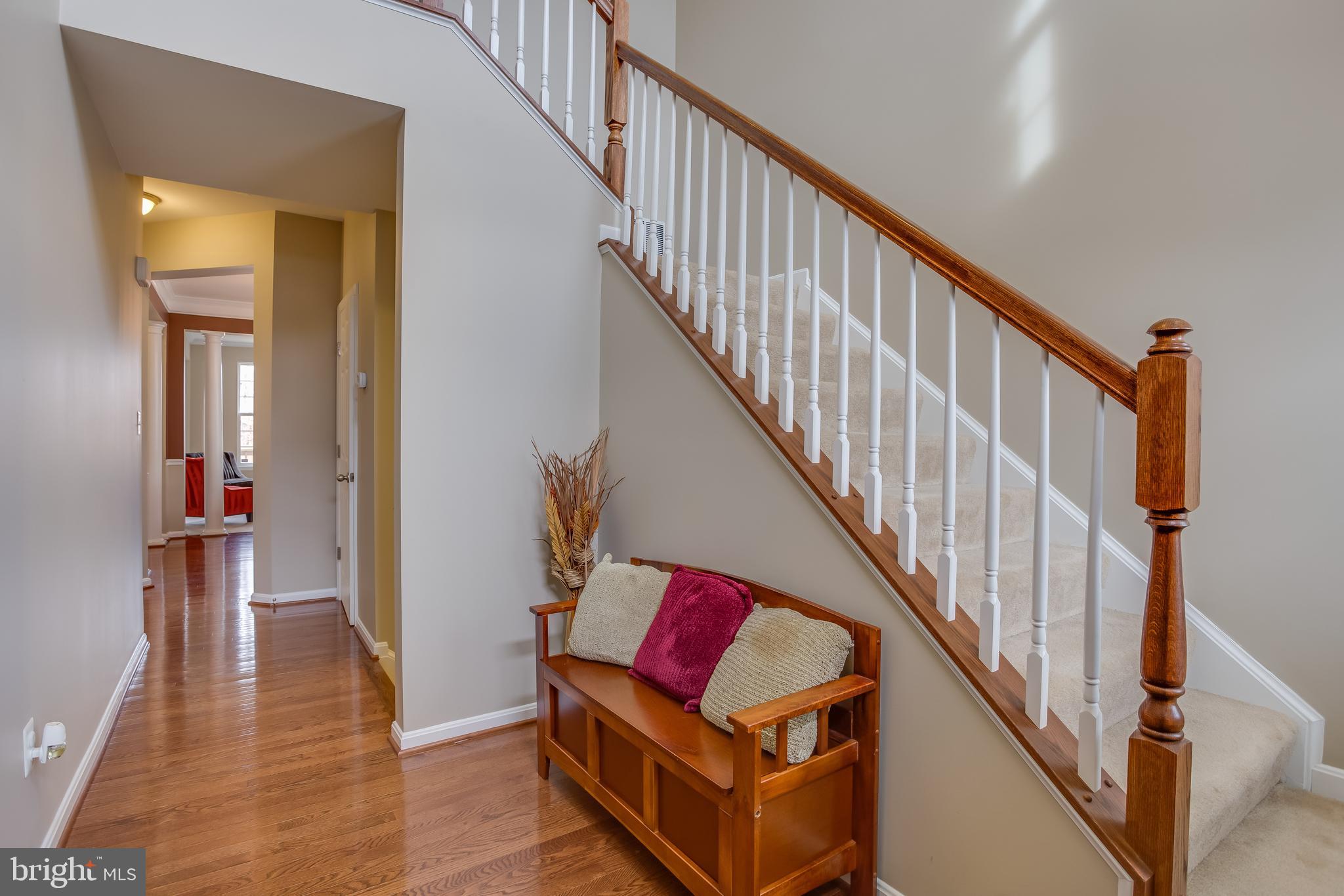 3437 Eagle Ridge Drive Woodbridge, VA 22191 - Photo 5 of 40 a view of a hallway with wooden floor and stairs