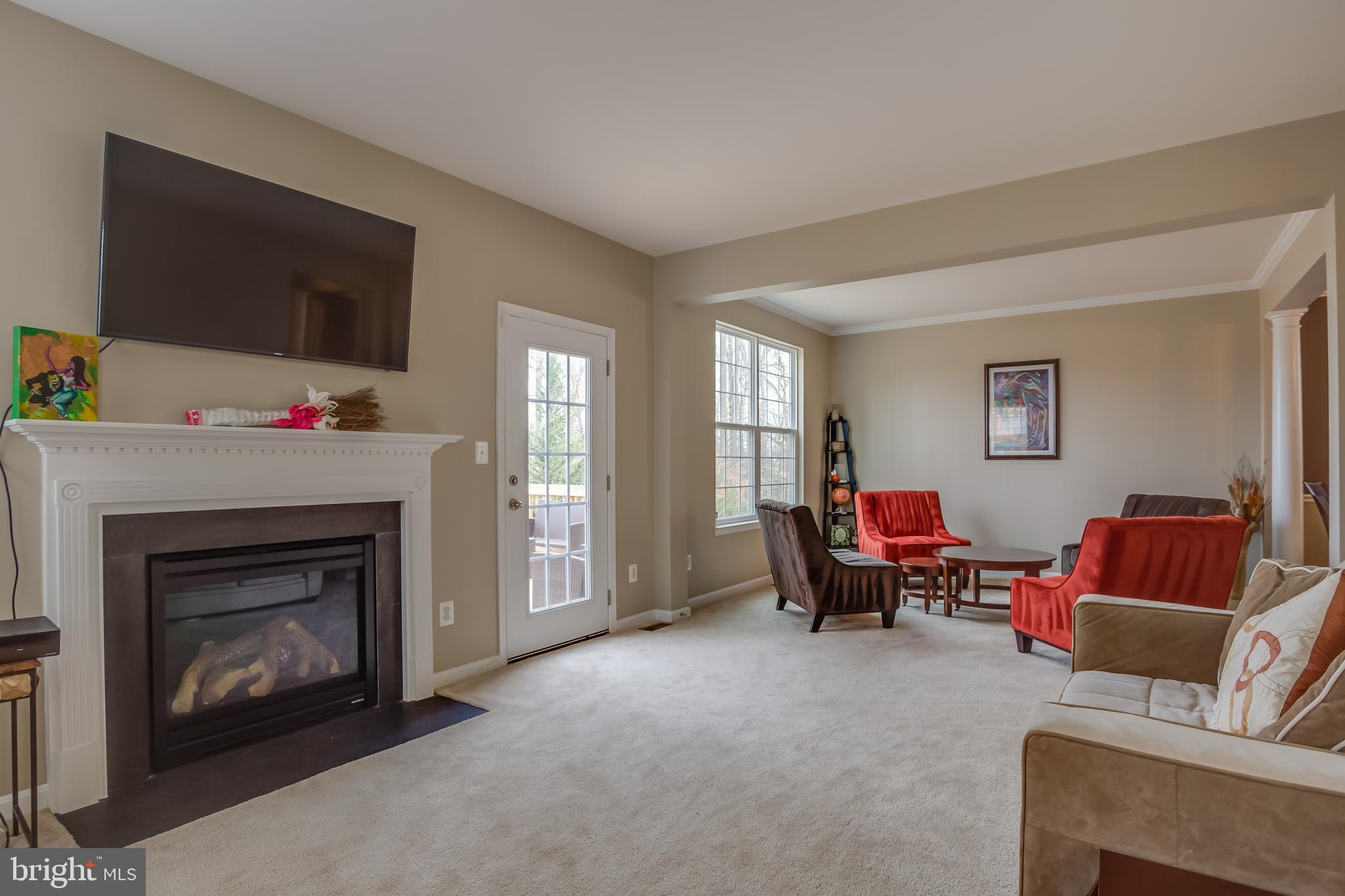 3437 Eagle Ridge Drive Woodbridge, VA 22191 - Photo 6 of 40 a living room with furniture and a fireplace