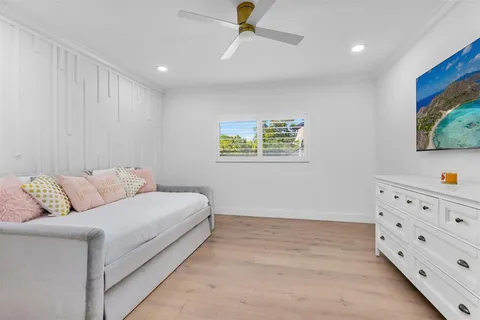 a bathroom with a sink toilet vanity and shower