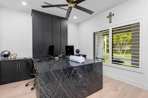 a view of a patio with a table chairs and a swimming pool