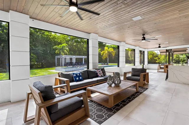 a kitchen with a table chairs sink and cabinets