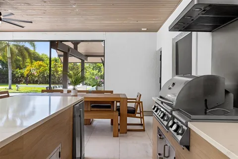 a house with swimming pool in front of it