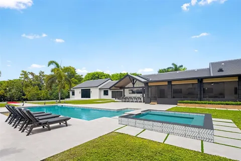 swimming pool with an outdoor seating