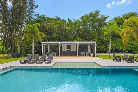 a view of a dining room with furniture and window