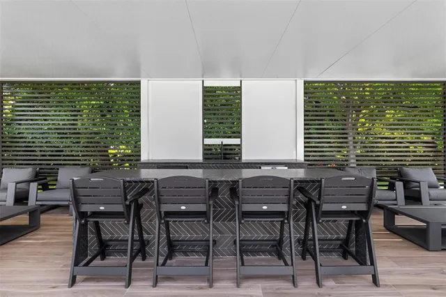 a view of a swimming pool with a lounge chair