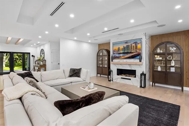 a kitchen with kitchen island granite countertop a sink and refrigerator
