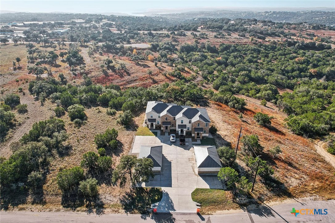 289 Star Grass, Unit 3 Spring Branch, TX 78070 - Photo 38 of 40 an aerial view of residential building with green space