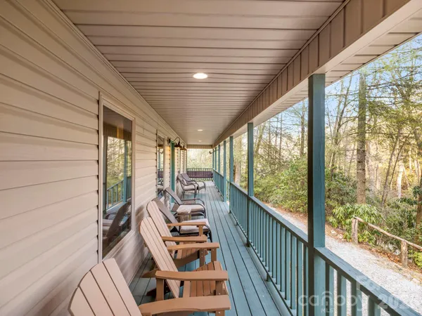 a view of a balcony with chairs