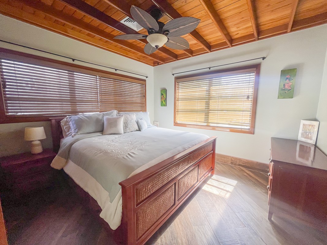 0 Belizean Shores, Unit 11B Robstown, TX 78380 - Photo 12 of 32 a bedroom with a bed and wooden floor