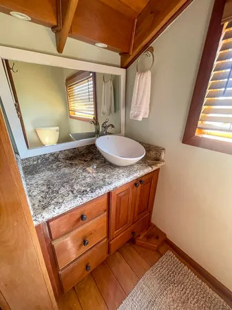 a room with granite countertop furniture and a mirror