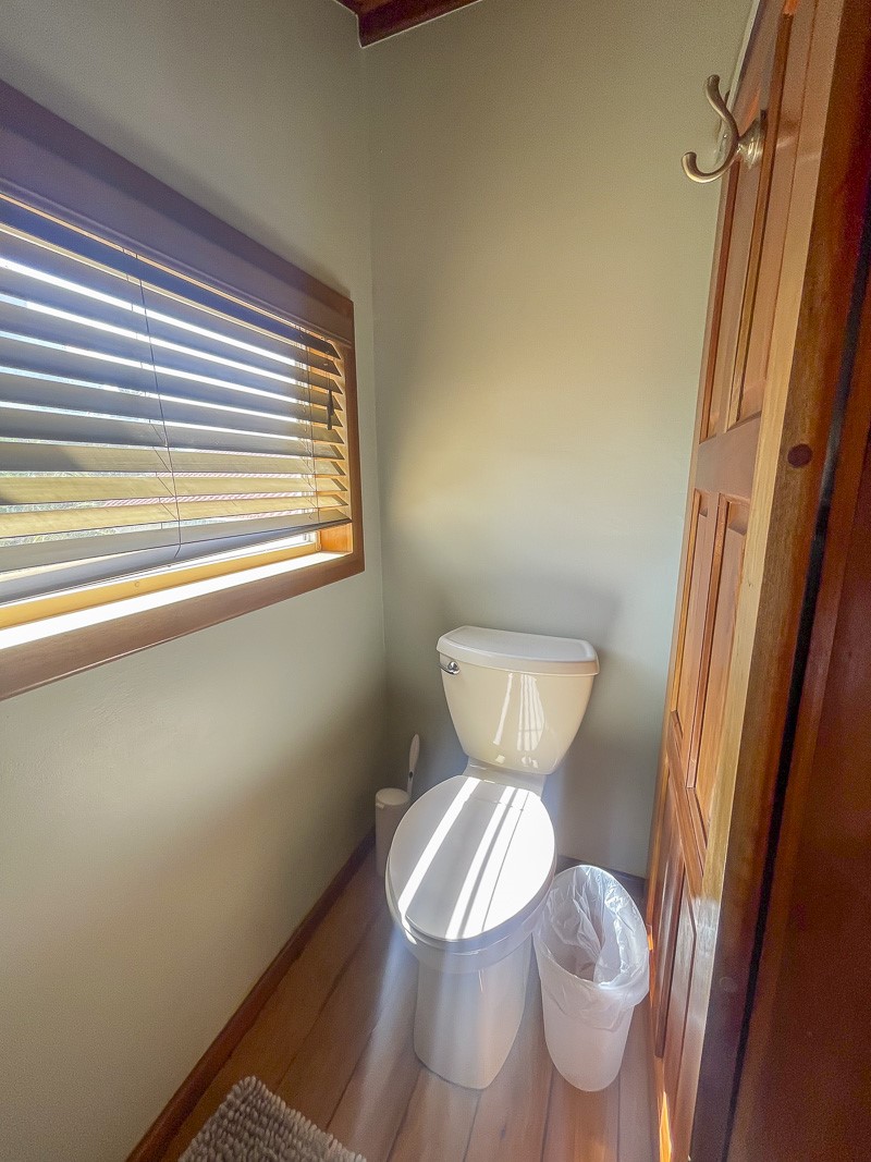0 Belizean Shores, Unit 11B Robstown, TX 78380 - Photo 20 of 32 a toilet sitting in a bathroom next to a window