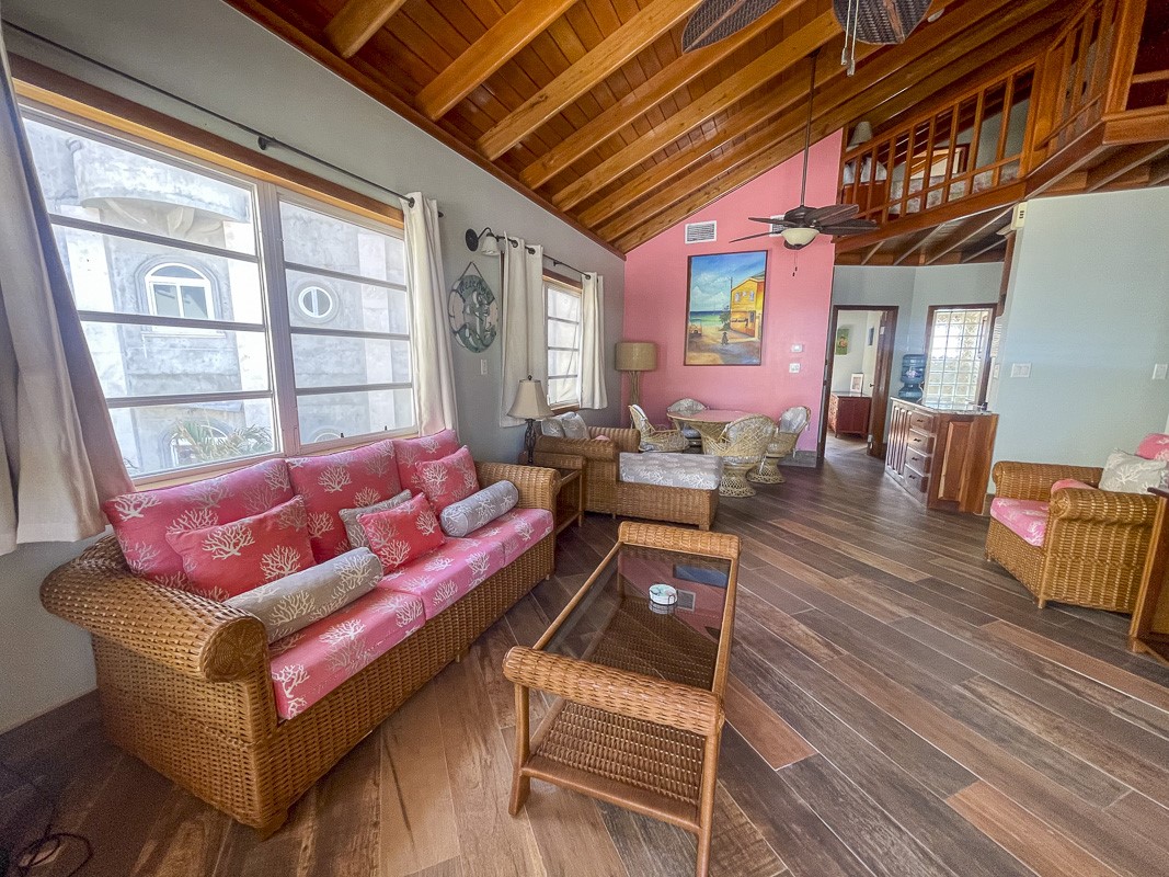 0 Belizean Shores, Unit 11B Robstown, TX 78380 - Photo 8 of 32 a living room with furniture a wooden floor and a large window