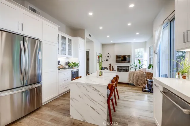 a view of a backyard with plants and a patio