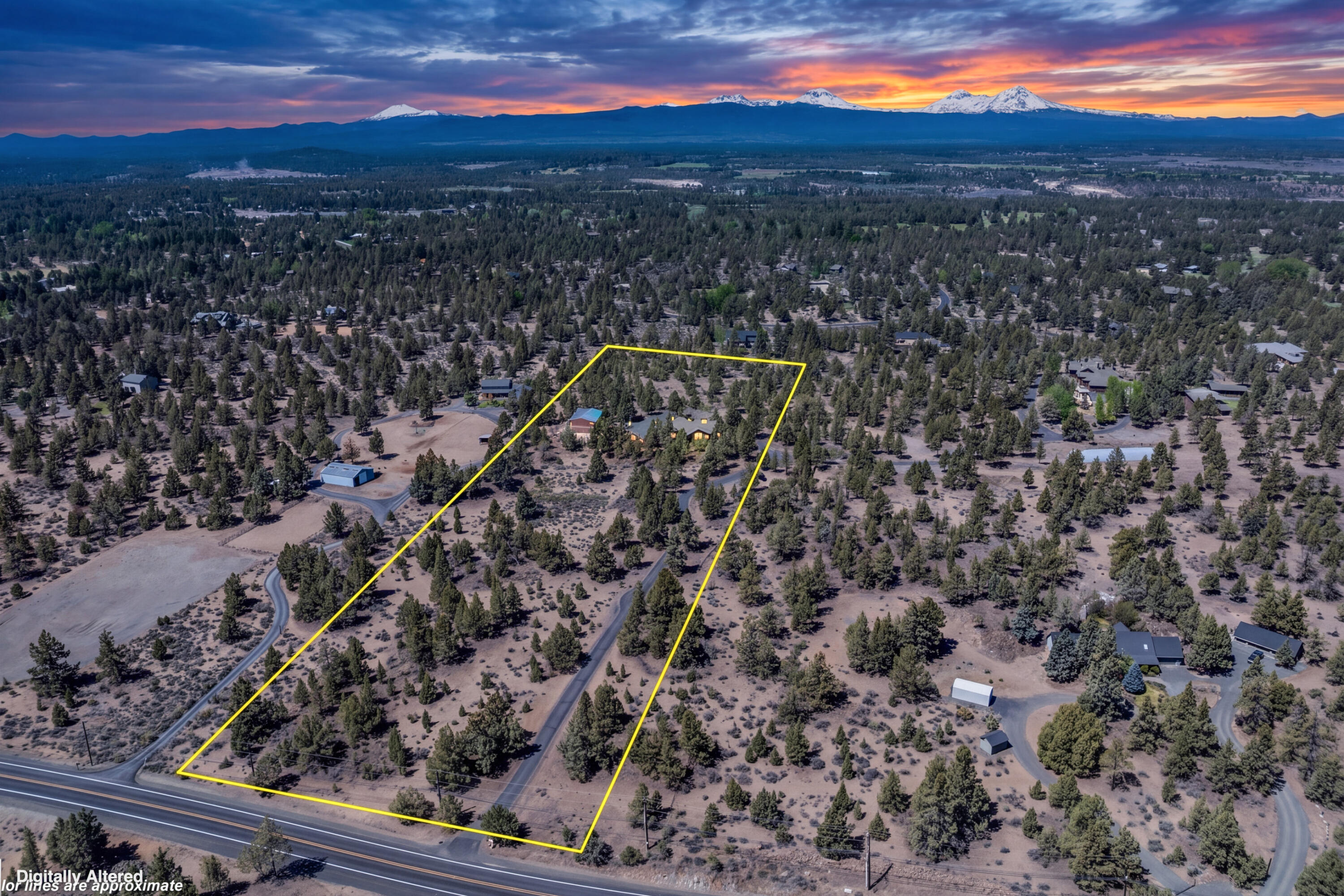 64145 Hunnell Road Bend, OR 97703 - Photo 63 of 65 The outlined aerial view highlights the approximate boundaries of the 9.46-acre property, showing the scale, privacy and natural Central Oregon setting with Cascade Mountain views beyond.