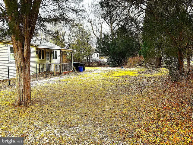 a view of a house with swimming pool and sitting area