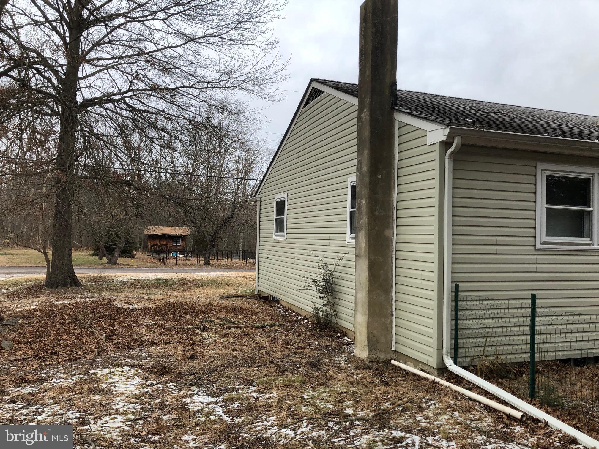 8 Roberts Lane Berlin, NJ 08009 - Photo 4 of 19 a view of a backyard with a large tree