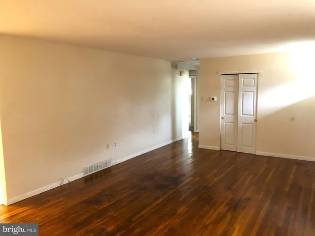 a kitchen with a cabinets a stove a sink and a refrigerator