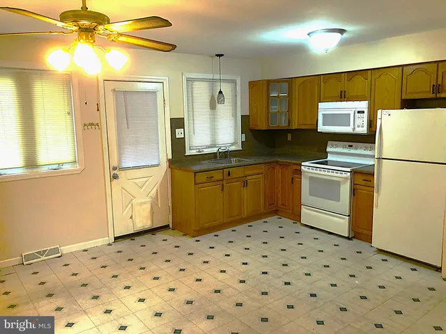 a view of a livingroom with wooden floor
