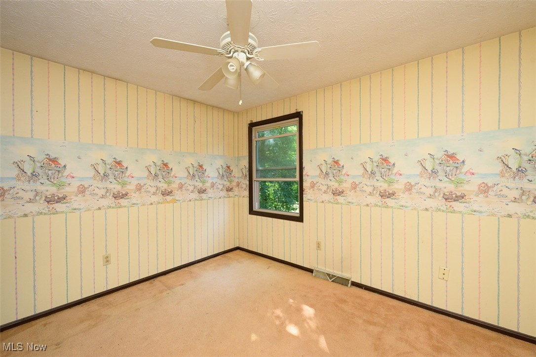 8838 Timberlink Road Northwest Canal Fulton, OH 44614 - Photo 12 of 30 Bedroom with ceiling fan and carpet flooring