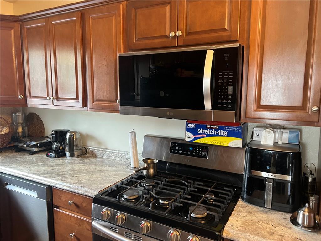 309 Magazine Street Carnegie, PA 15106 - Photo 6 of 18 a kitchen with wooden cabinets and a stove top oven