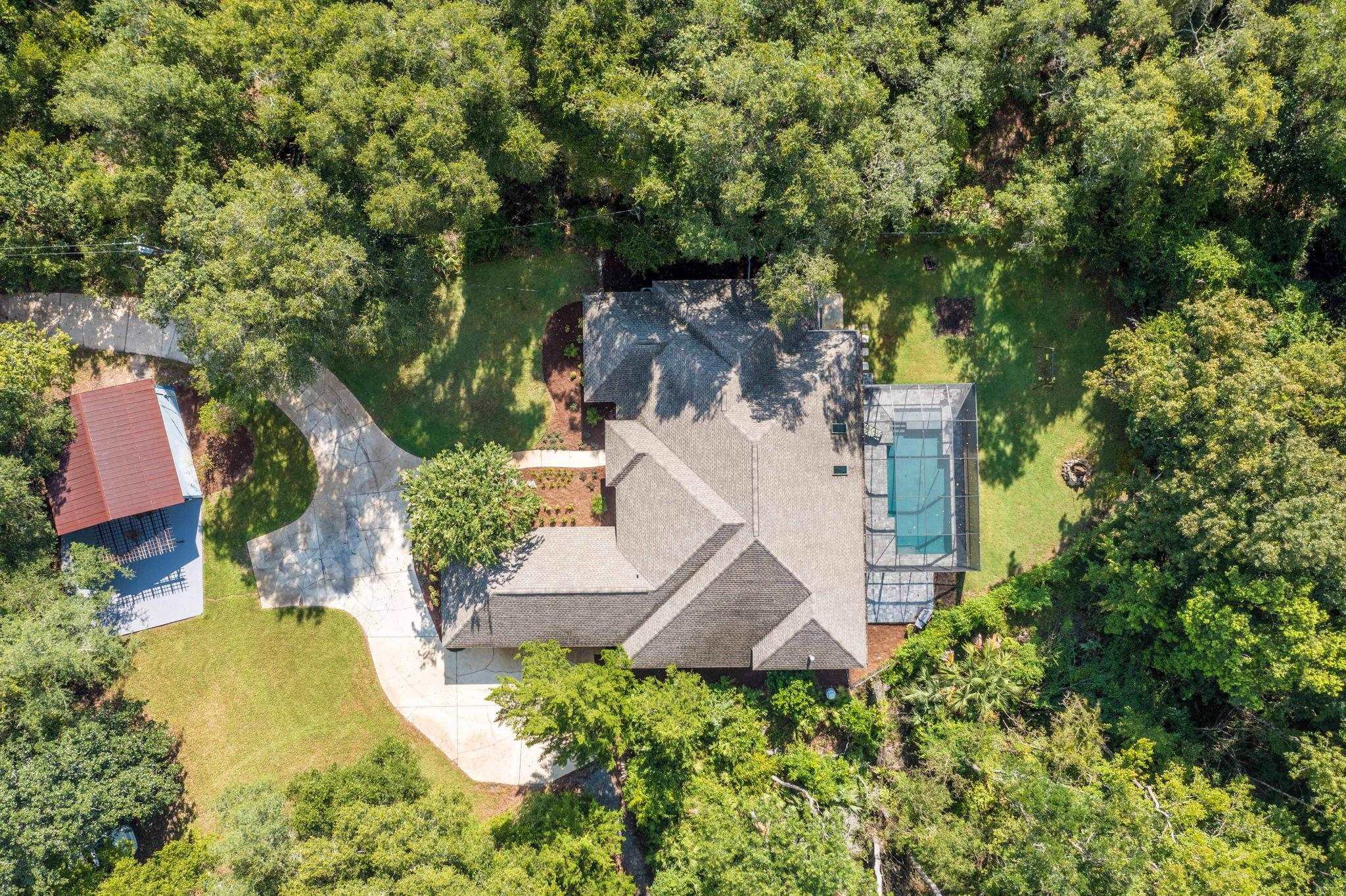 795 Kings Estate Road St. Augustine, FL 32086 - Photo 1 of 90 an aerial view of a house with swimming pool and garden space