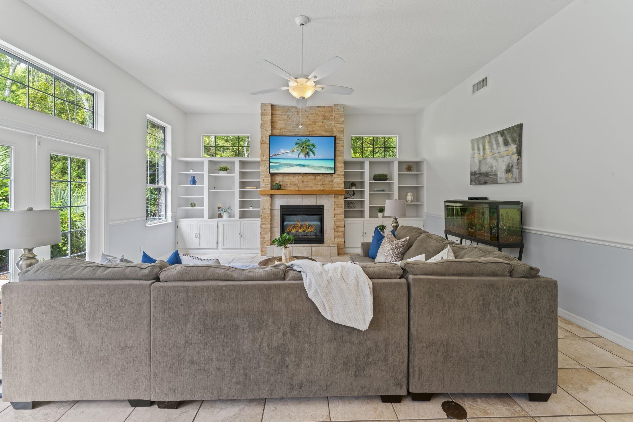 795 Kings Estate Road St. Augustine, FL 32086 - Photo 24 of 90 a living room with fireplace furniture and a fireplace