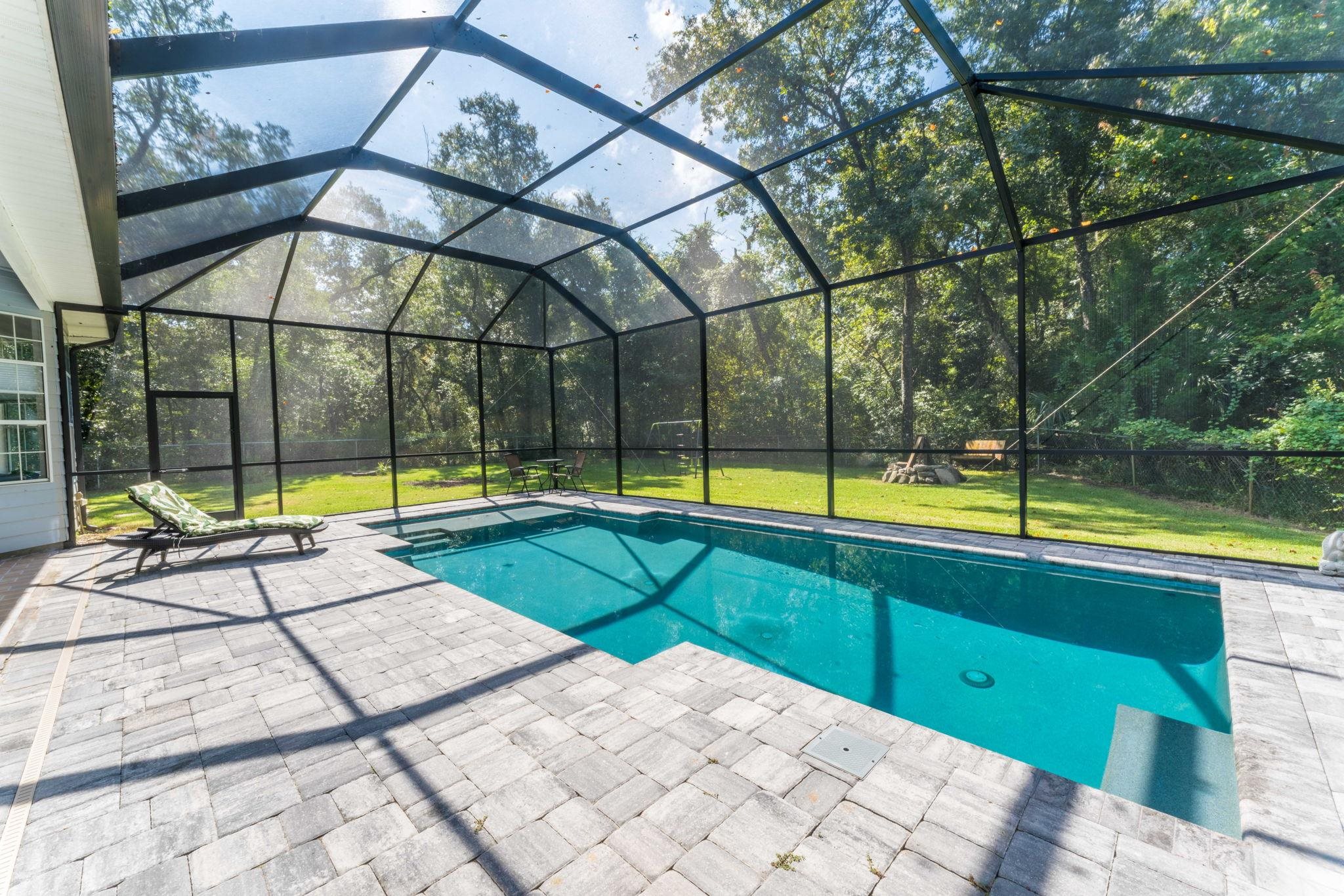795 Kings Estate Road St. Augustine, FL 32086 - Photo 53 of 90 a view of a swimming pool with a yard and sitting area