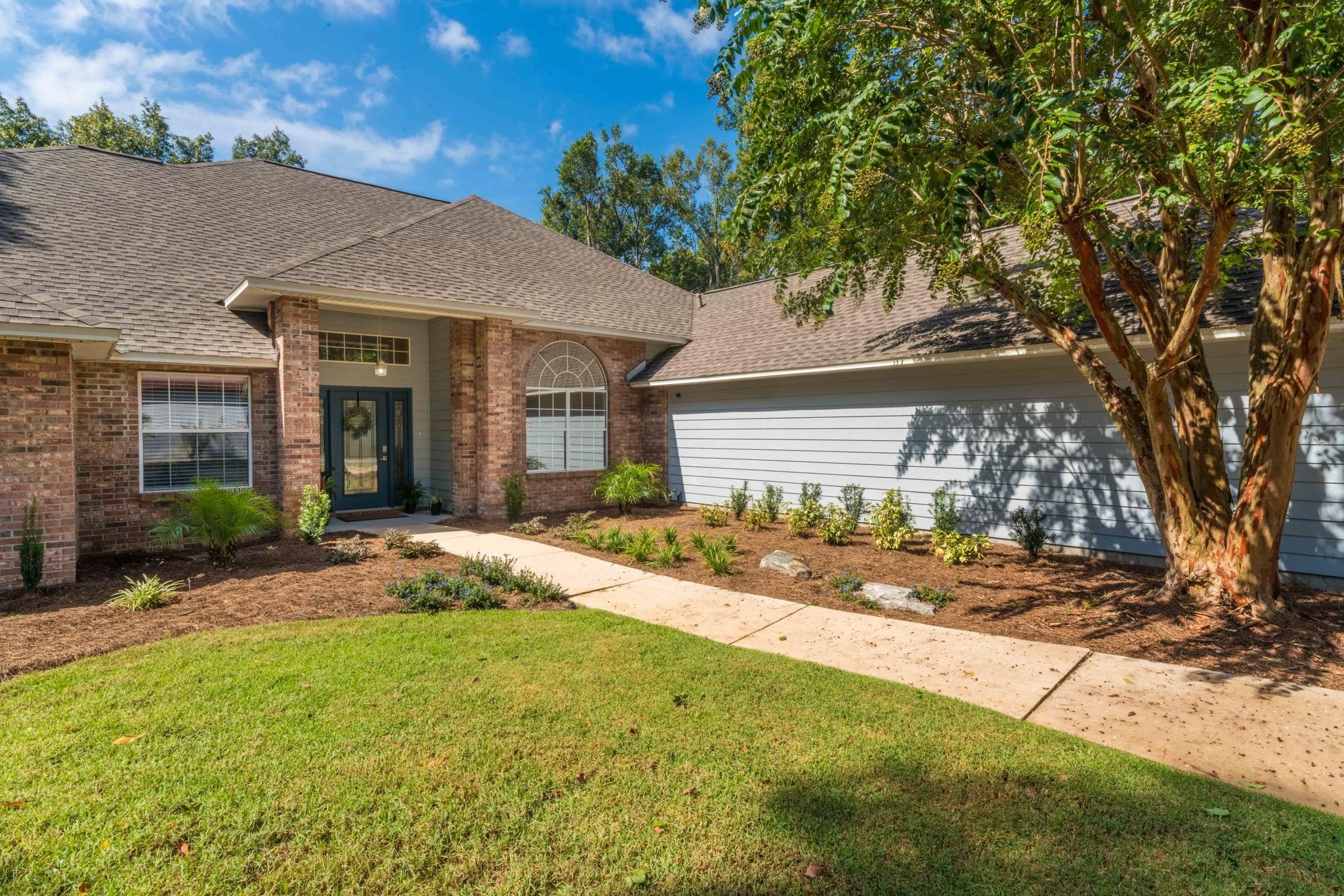 795 Kings Estate Road St. Augustine, FL 32086 - Photo 63 of 90 a front view of a house with a garden