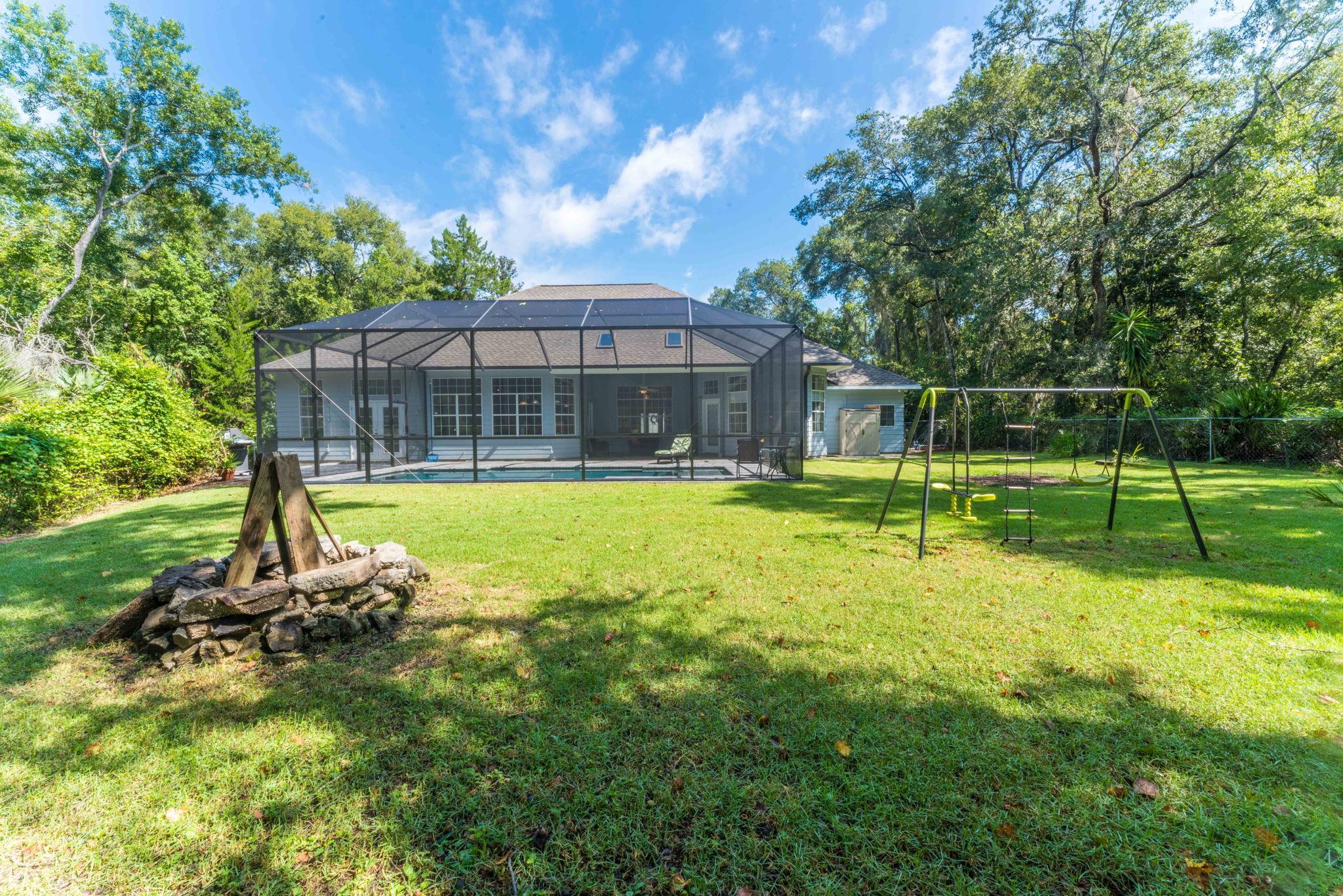 795 Kings Estate Road St. Augustine, FL 32086 - Photo 66 of 90 a view of a house with a yard porch and sitting area