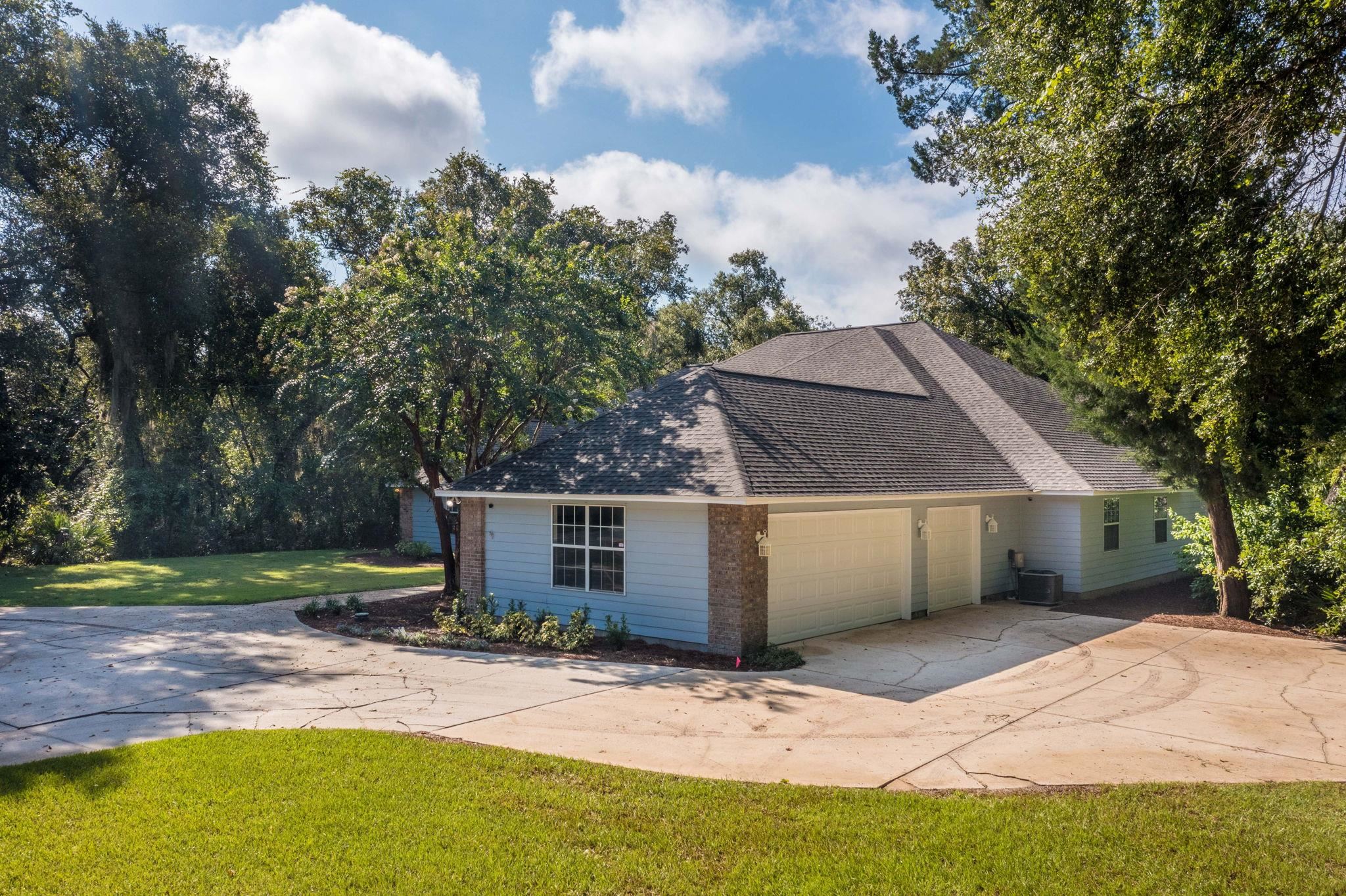795 Kings Estate Road St. Augustine, FL 32086 - Photo 73 of 90 a front view of a house with a yard and garage