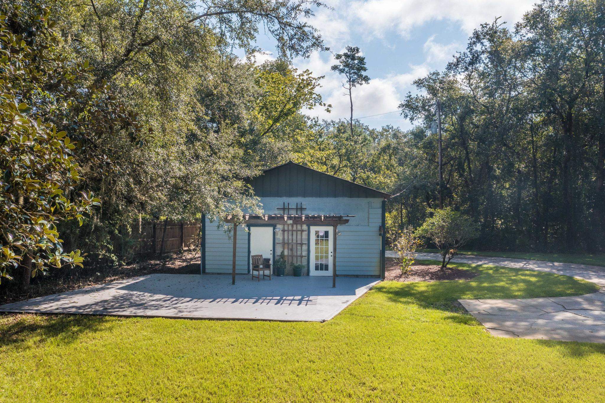 795 Kings Estate Road St. Augustine, FL 32086 - Photo 74 of 90 a view of house with swimming pool and trees in the background