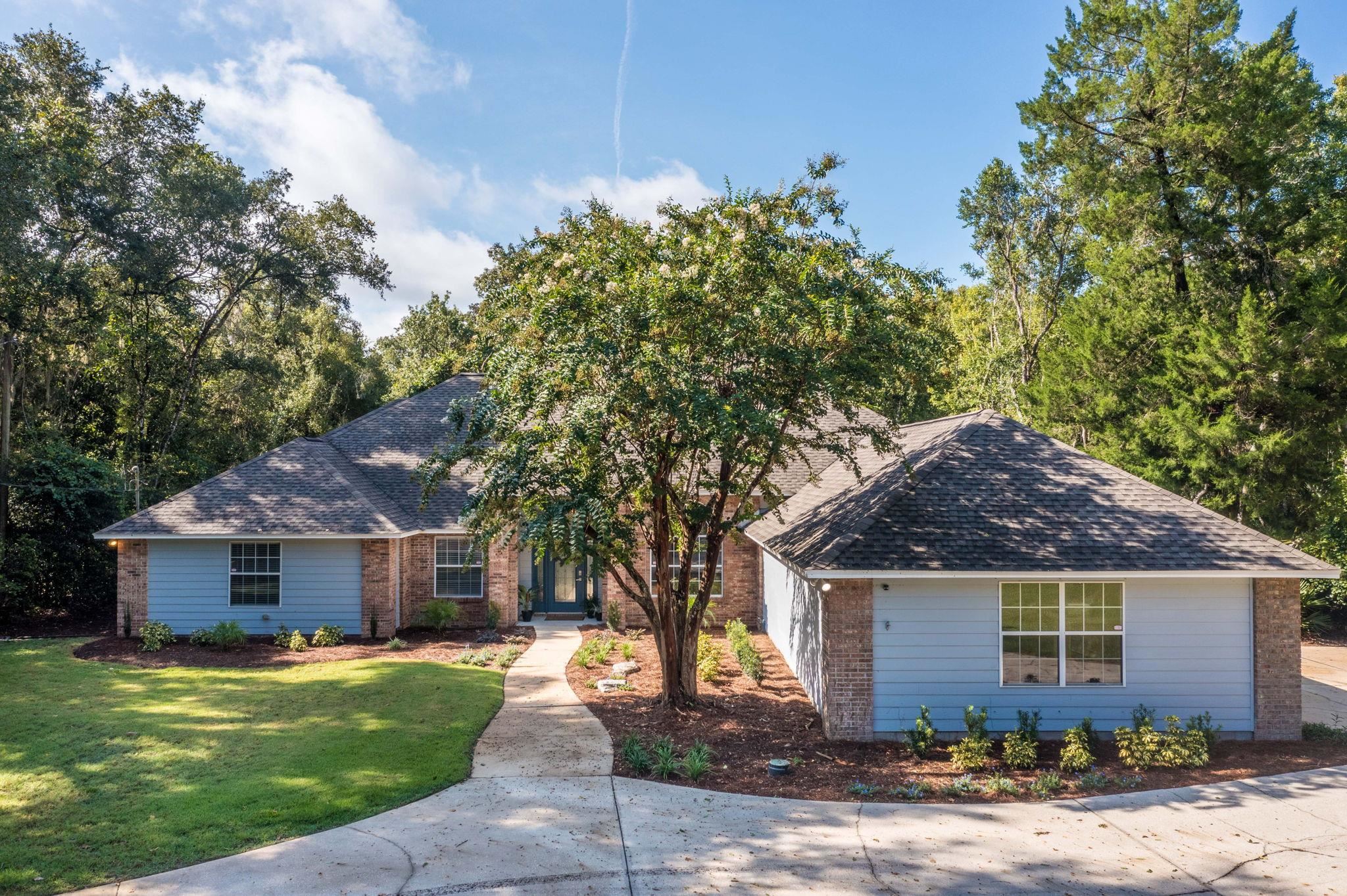 795 Kings Estate Road St. Augustine, FL 32086 - Photo 76 of 90 a front view of a house with a garden