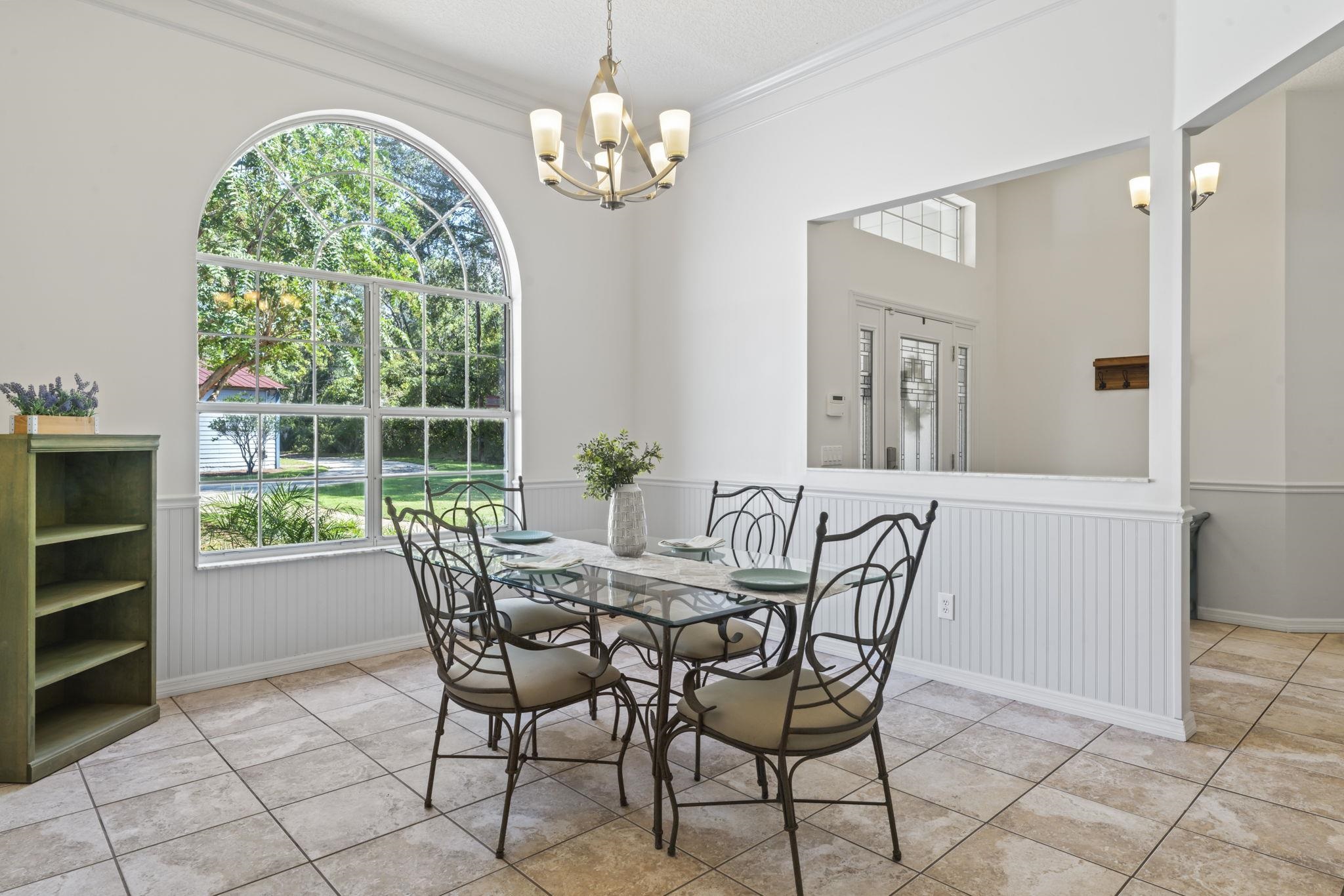795 Kings Estate Road St. Augustine, FL 32086 - Photo 8 of 90 a view of a dining room with furniture and chandelier