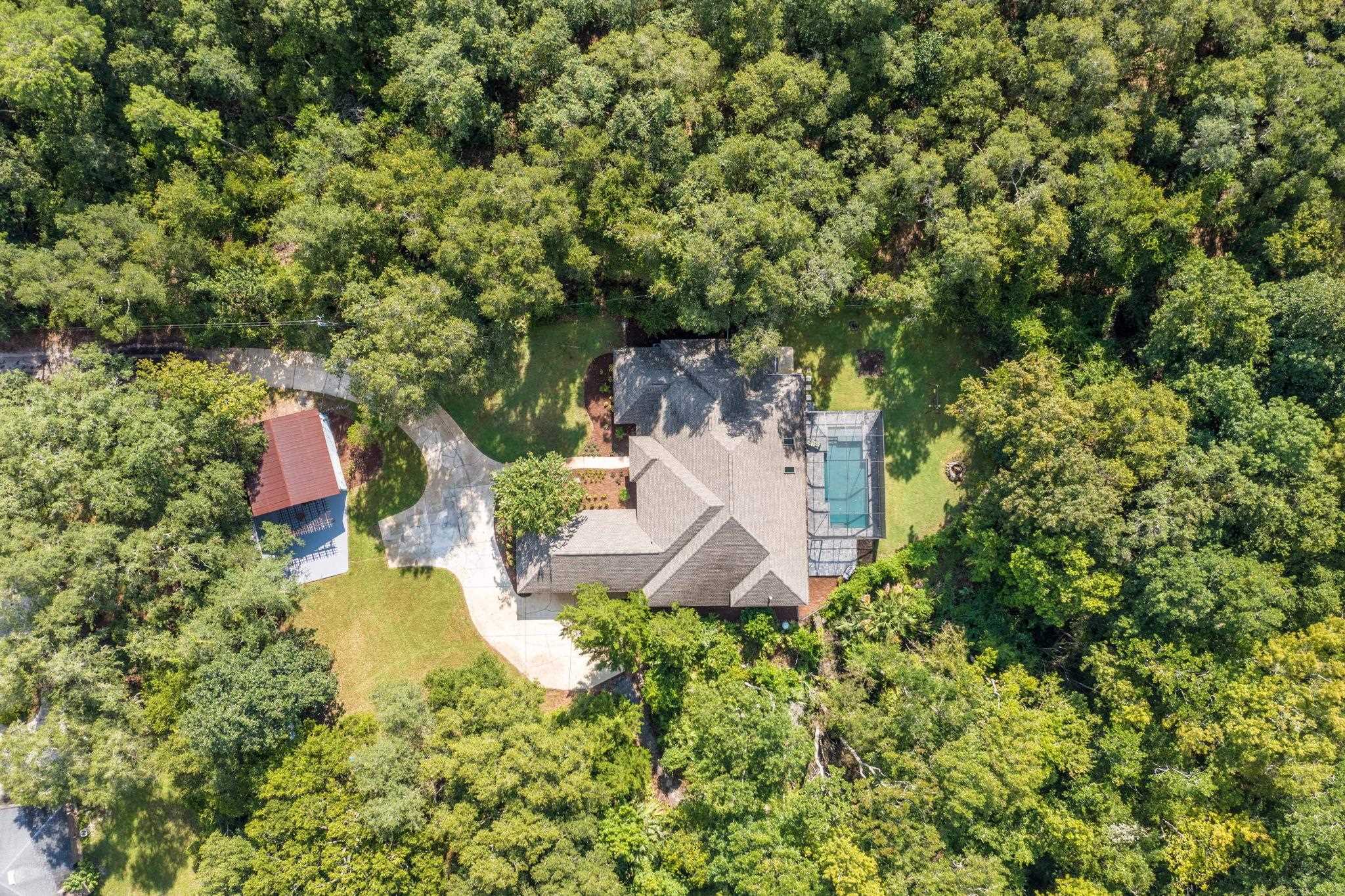 795 Kings Estate Road St. Augustine, FL 32086 - Photo 81 of 90 an aerial view of a house with a yard and large trees