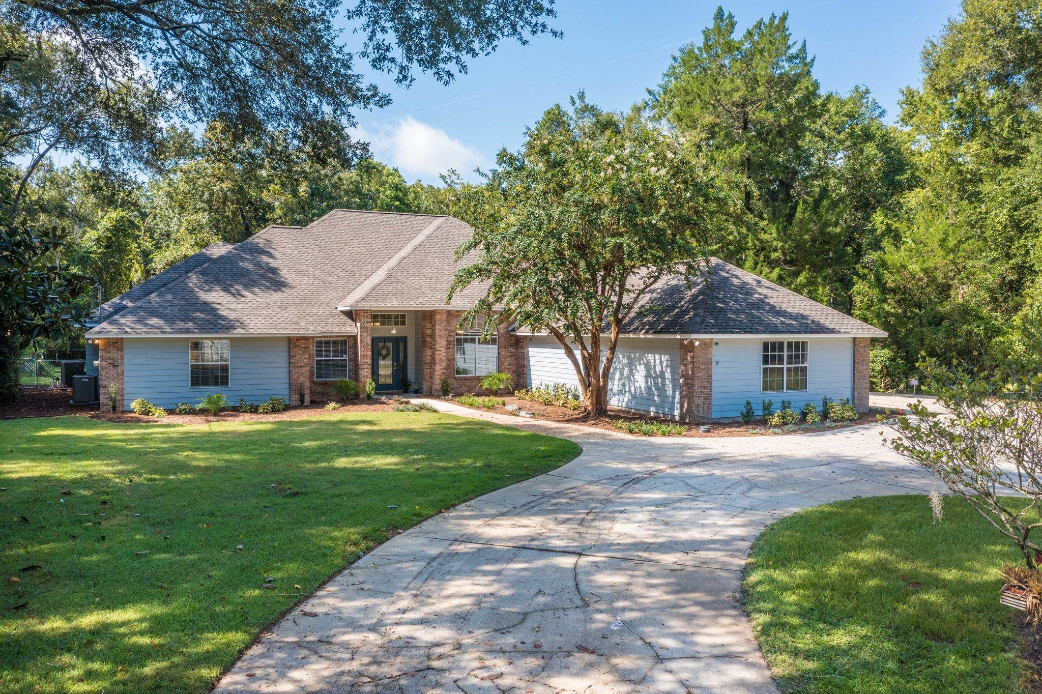 795 Kings Estate Road St. Augustine, FL 32086 - Photo 86 of 90 a front view of a house with a garden
