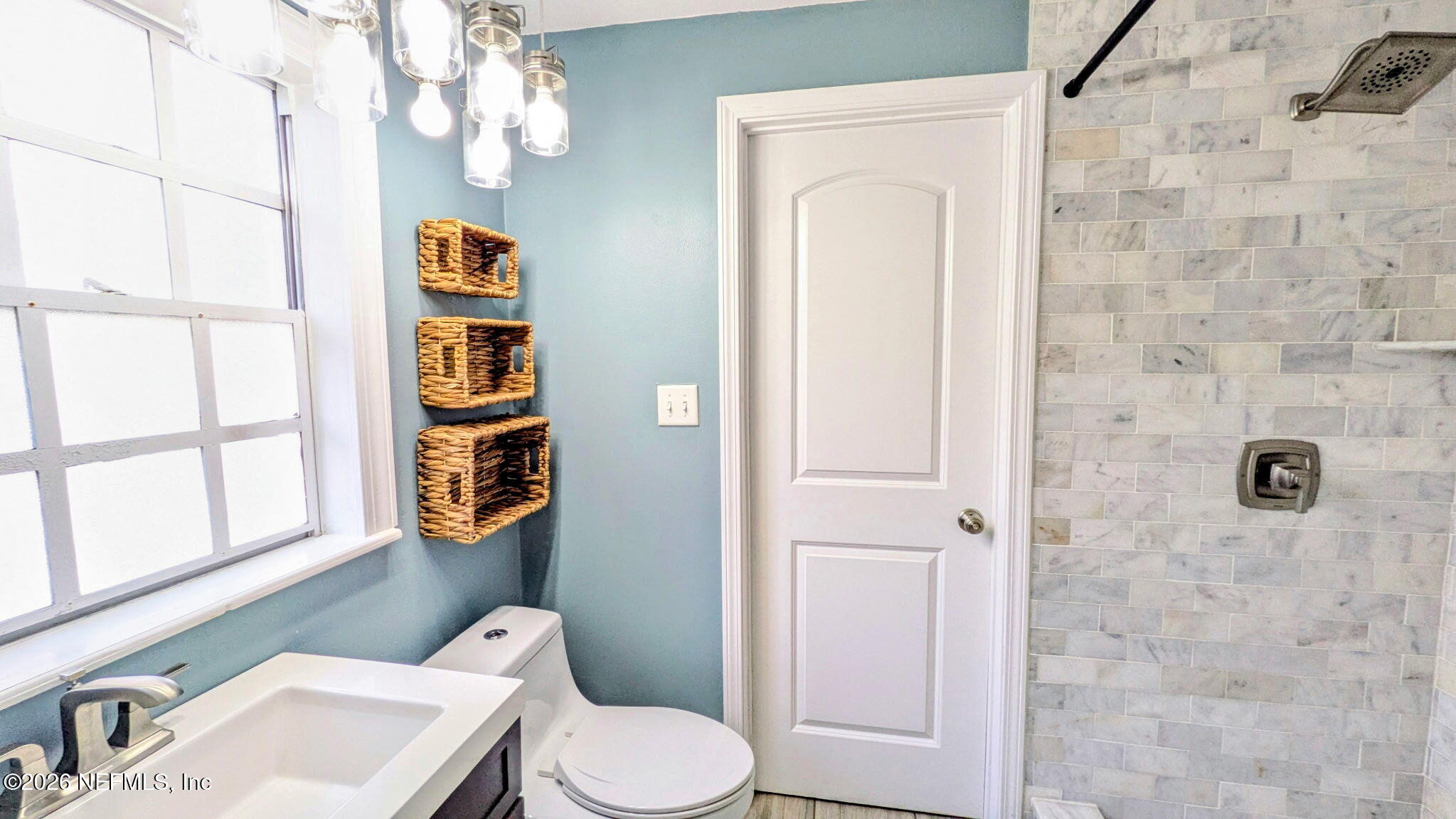 1218 Dancy Street Jacksonville, FL 32205 - Photo 12 of 19 a bathroom with a toilet a sink and mirror