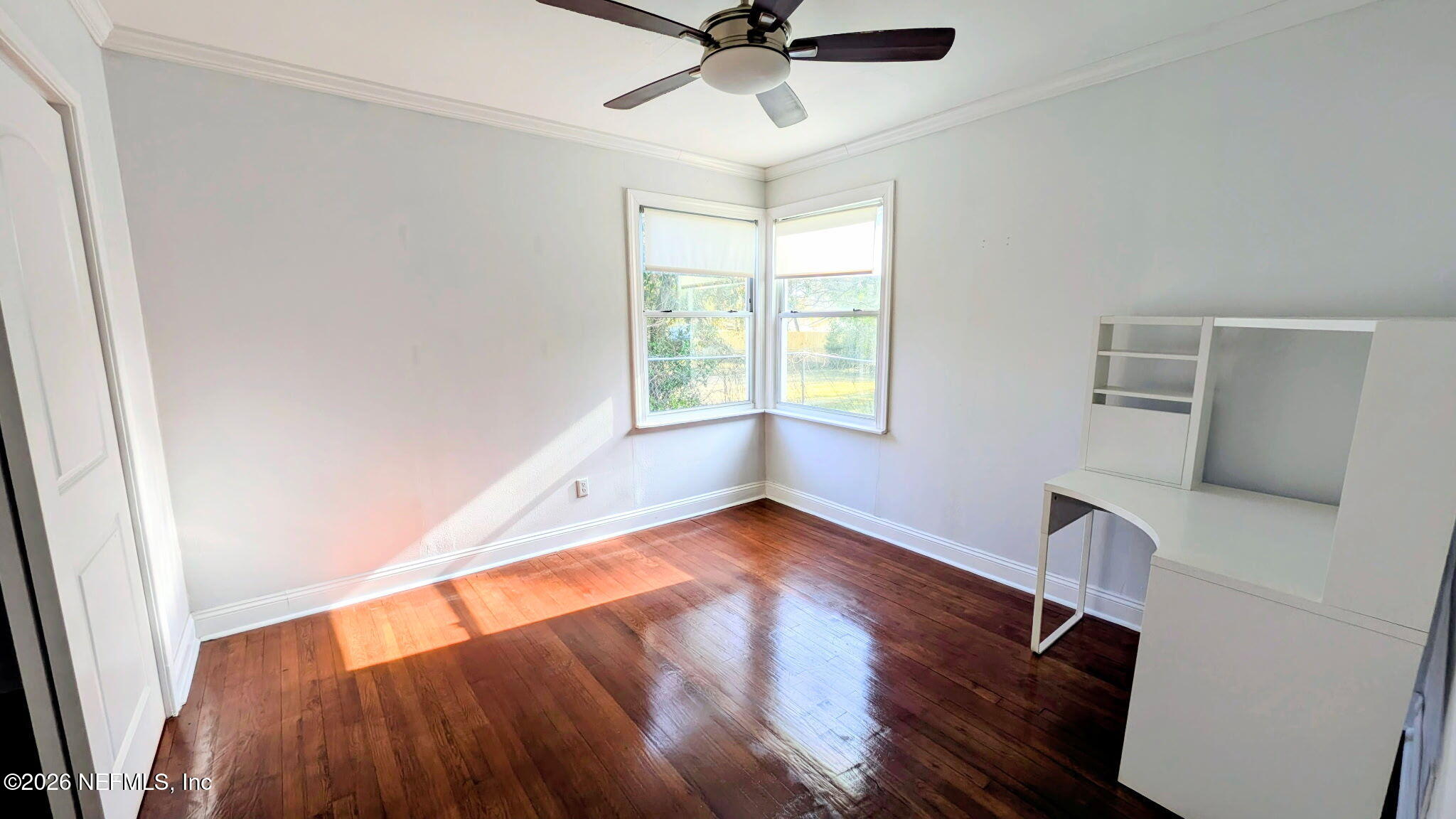 1218 Dancy Street Jacksonville, FL 32205 - Photo 18 of 19 a view of an empty room with a window and wooden floor