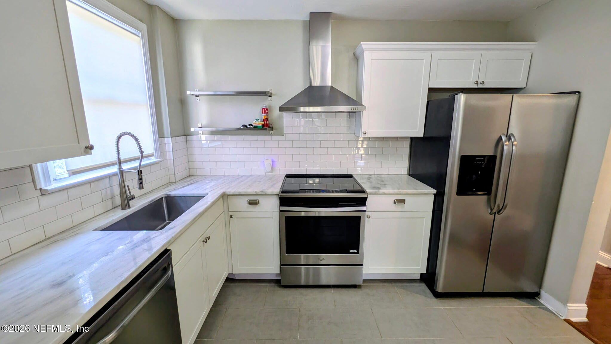 1218 Dancy Street Jacksonville, FL 32205 - Photo 7 of 19 a kitchen with stainless steel appliances granite countertop a sink stove and refrigerator
