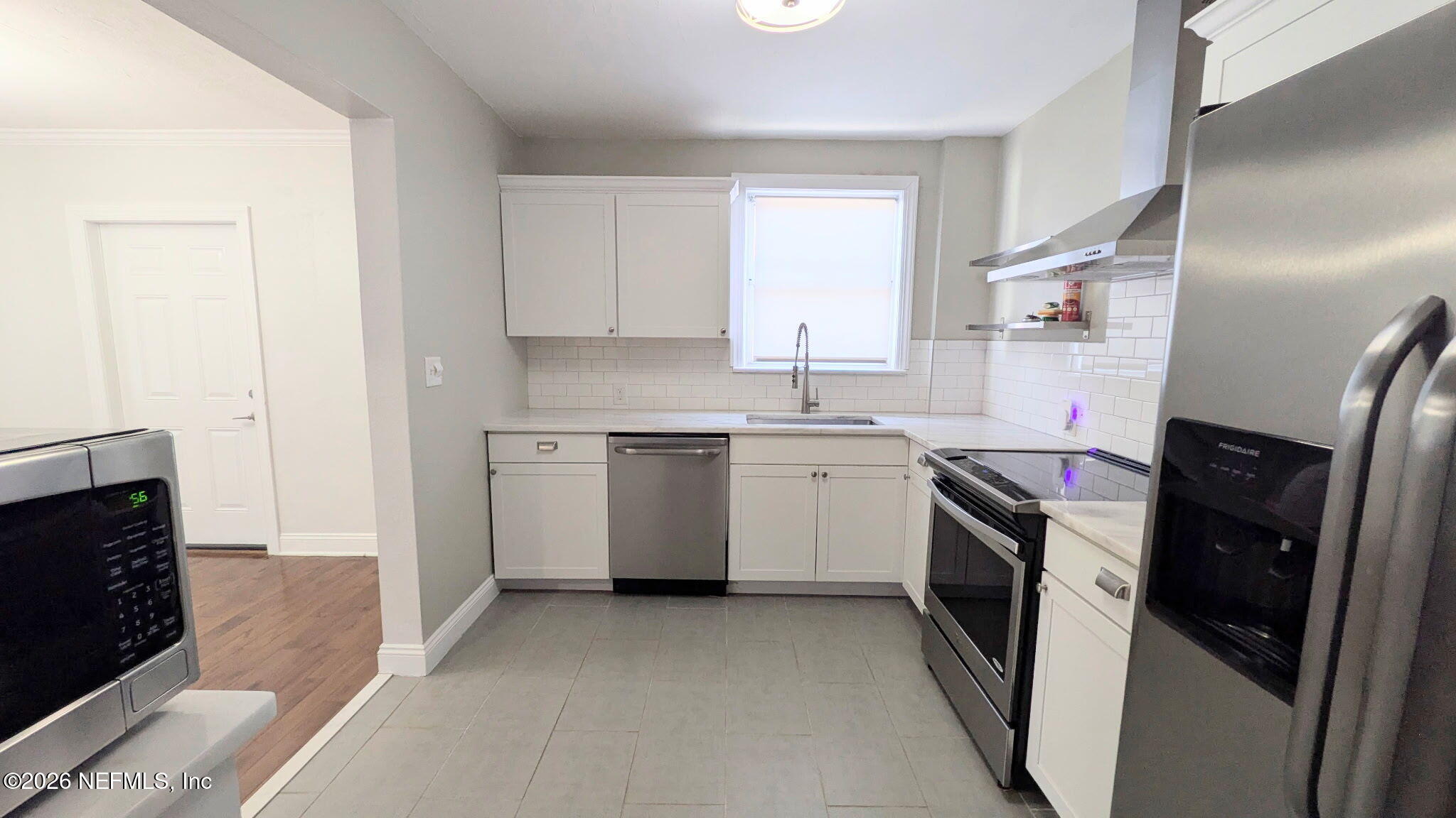1218 Dancy Street Jacksonville, FL 32205 - Photo 8 of 19 a kitchen with a sink a washer and dryer