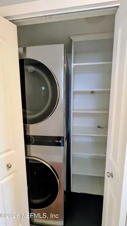a utility room with washing machine