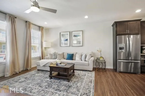 a living room with furniture and a rug
