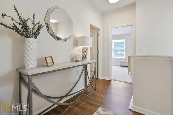 a bathroom with a sink mirror and vanity