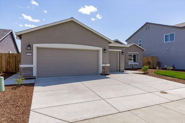 a front view of a house with a garage